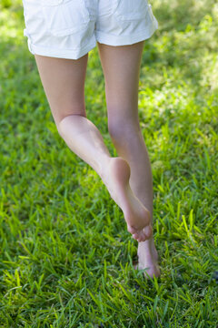 Woman Walking in the Grass, Miami Beach, Dade County, Florida, USA
