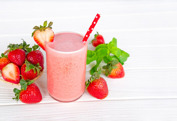 Strawberry yogurt fruit juice smoothie pink colorful fruit juice milkshake blend beverage healthy high protein the taste yummy In glass drink episode morning on white wood background.