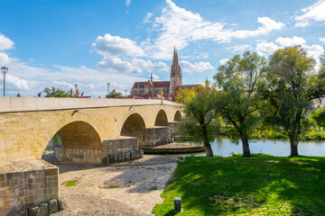 The old stone bridge over the Danube with the Saint Peter Cathedral in view in the Bavarian city of...