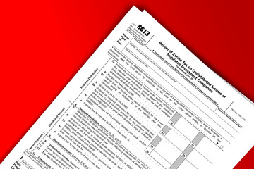 Form 8613 documentation published IRS USA 10.28.2016. American tax document on colored