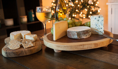 Fototapeta na wymiar Cheese plate and wine including chardonnay, gourmet crackers