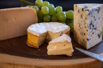 Cheese plate and wine including chardonnay, gourmet crackers