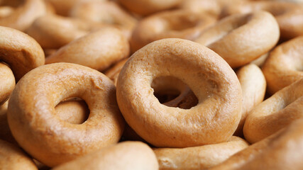 Tasty dry bagels (sushki) as background, closeup