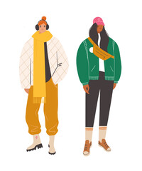 Women characters wearing trendy winter outfits. City street style modern fashion. Hand drawn vector illustration.