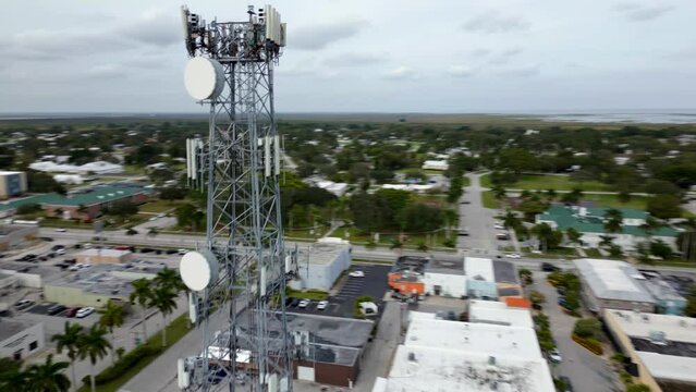 Aerial video Town of Clewiston reveal behind cell tower