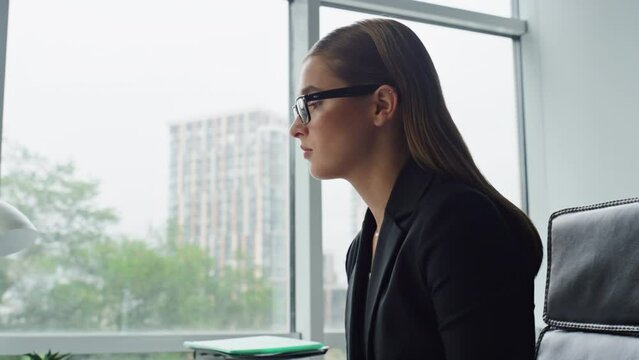 Closeup manager typing computer in office. Beautiful businesswoman ponder issue