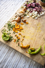 Colorful vegetables ready to use on a cutting board - healthy vegan and vegetarian lifestyle flat lay