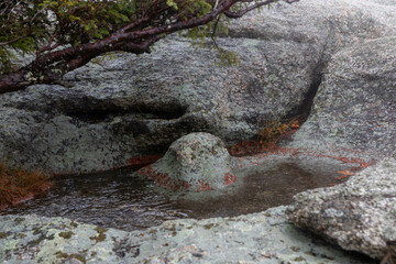 Moody and Misty View of a Rock on a Mountain