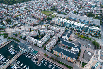 Aerial Drone View of Baltimore City Harbor with Boats Parked at Docks