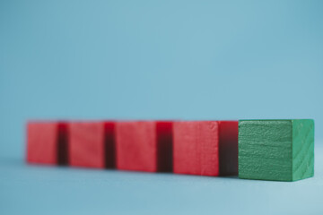 Selective focus on Green Blank Wooden cubes over blue background use for Banner,wallpaper,background idea.,Business design,financial,education,abstract,logo,text concept.