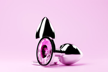 3D illustration.  Silver  butt anal plugs sex toys on  pink background. - obrazy, fototapety, plakaty
