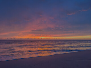 Obraz premium Beautiful sunrise on the Atlantic Ocean. Photo of the ocean. Background. Soft focus