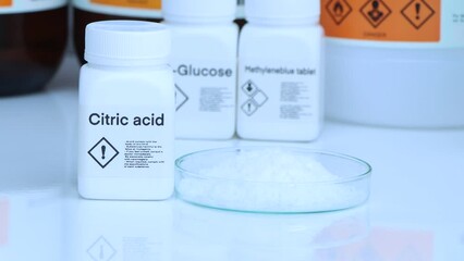 Citric acid in bottle , chemical in the laboratory and industry