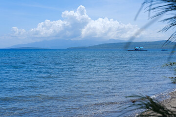 sunny day at Bangsring Beach Banyuwangi, floating house in the ocean, blue sky and sea, sea and sky, boat in the sea, beach and sea