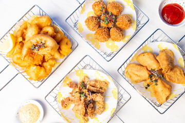 fried crispy pork belly, chicken wing, seafood, porkball with sauce