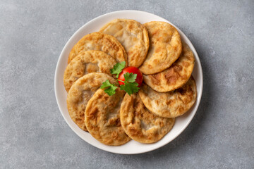 Delicious meat pie from Turkish cuisine. Fried handmade pies. Turkish name; fincan boregi or puf borek