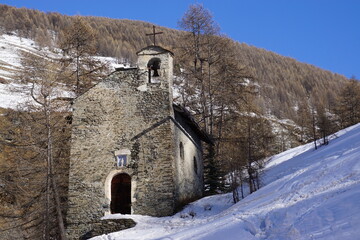 Fototapeta premium old stone church in the mountains in the southern Alps, France on a winter day