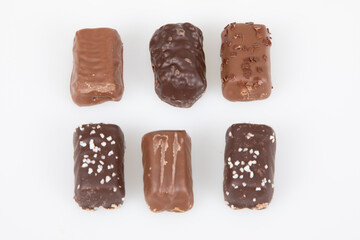 Assortment of variety fine artisanal chocolate pralines rectangle milk dark candies in flat top view