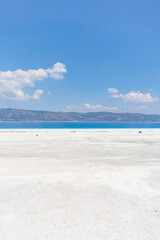 Obraz premium The turquoise waters of Salda Lake, the white mineral-rich beach and the blue sky. Salda Lake is a turquoise crater lake. Salda Lake, Burdur, Turkey