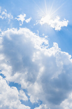 Clouds and sunny blue sky.
Sunny background, blue sky with white clouds and shine sun