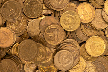 Old coins of the USSR in bulk on a flat surface, background image.