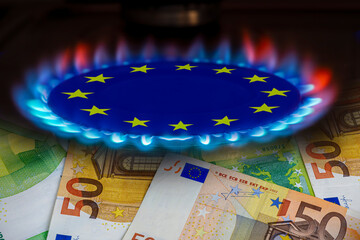 europe flag and hob burner of blue gas with euro cash banknotes on background, cost of gas, the euro crisis, sancions on russian gas, hob with blue gas flame and euro sign