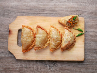 indonesia pastel cakes with peanut sauce on table top