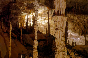 Flowstone cave Cuevas Drach (Cuevas Coves) at Mallorca Island, Spain, with stalactites at ceiling and stalagmite on the floor on an autumn day. Photo taken 11th October, 2022, Mallorca Island, Spain.