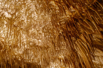 Flowstone cave Cuevas Drach (Cuevas Coves) at Mallorca Island, Spain, with stalactites at ceiling on an autumn day. Photo taken 11th October, 2022, Mallorca Island, Spain.
