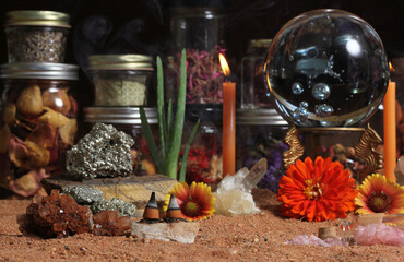 Crystal Ball With Candles and Chakra Stones on Australian Red Sand