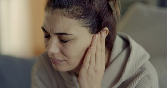 Young woman with ear pain