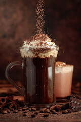 Coffee and hot chocolate sprinkled with chocolate crumbs.