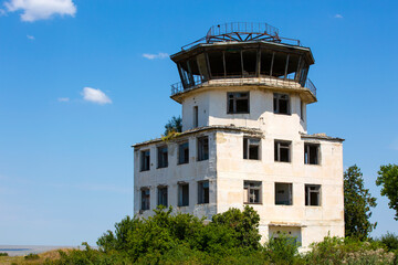Fototapeta na wymiar old abandoned control tower at the old airport