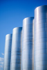Row of stainless steel fermentation wine tanks