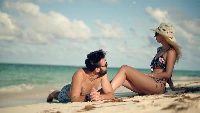 happy couple enjoying beach at an all-inclusive resort