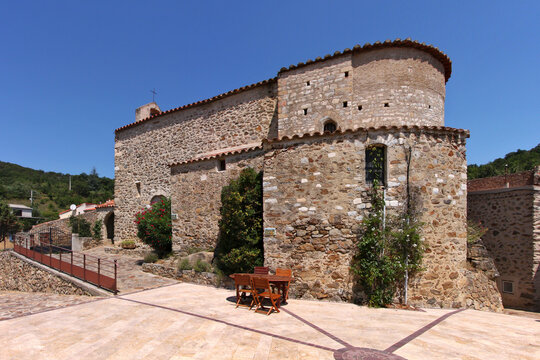 Medieval church at the village square of Feilluns, Occitanie region in France