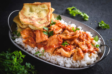 Fototapeta premium Delicious fish curry with naan bread