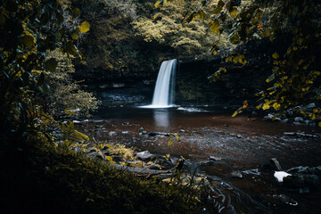 Fototapeta na wymiar Sgwd Gwladys or Lady Falls along the Four Waterfalls walk, Waterfall Country, Brecon Beacons national park, South Wales, the United Kingdom. No people. Long exposure.
