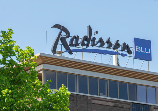 Riga , Latvia March 7th 2021: Radisson blue sign on the roof.
