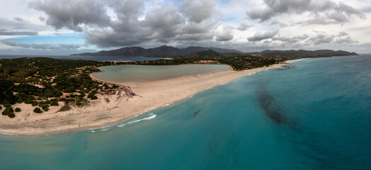 aerial panorama of Capo Carbonara and the beach and lake near Villasimius in southeastern Sardinia