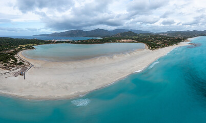 aerial panorama of Capo Carbonara and the beach and lake near Villasimius in southeastern Sardinia