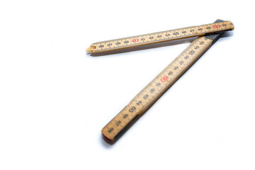 Broken wood metric folding ruler isolated on white background, space for text.