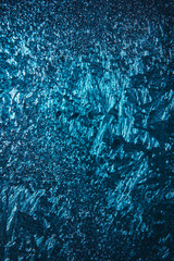 window behind frosty patterns. winter background