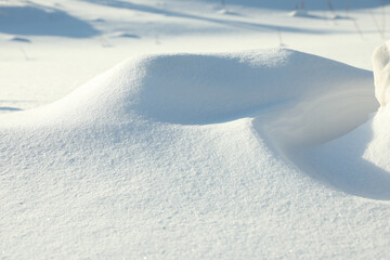 Beautiful snowdrift as background, closeup view. Winter weather