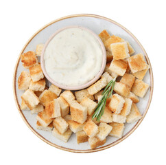 Delicious crispy croutons with rosemary and sauce on white background, top view