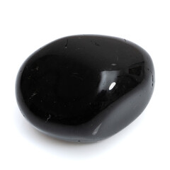 Natural gemstone black onyx isolated on white background