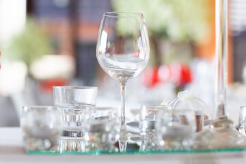 Wine glasses and goblets are placed on the table at the ceremony. beautifully arranged ready for table participants to dine.