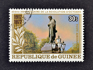 Cancelled postage stamp printed by Guinea, that shows Pushkin Monument, 60th Anniversary of the...