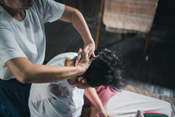 Massage and spa relaxing treatment of office syndrome traditional thai massage style. Asain senior...