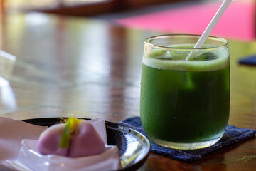 Cold "matcha" (green tea) served in a Japanese tea room.
Enjoy with Japanese confectionery like cherry blossom.